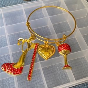 Gold plated bangle with charms